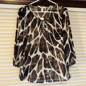 Brand new Banana Republic sheer animal printed blouse.  Size medium.